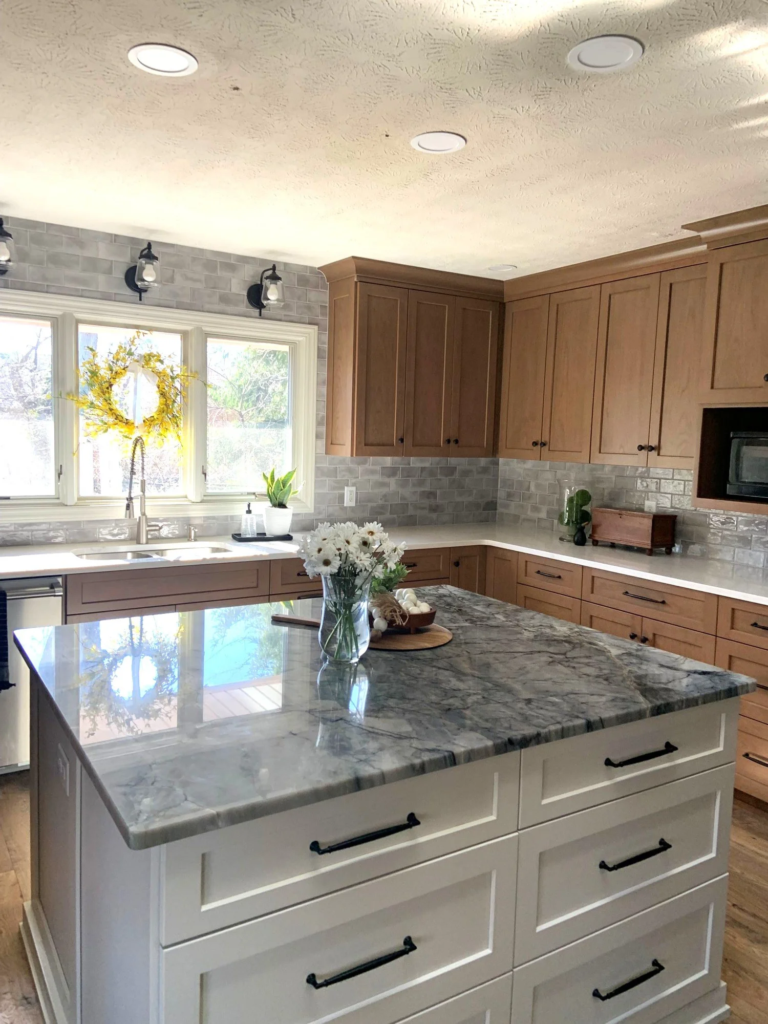Centerville, Ohio kitchen remodel with grey marble island and grey tile backsplash